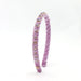 A lavender velvet headband decorated with small gold and clear rhinestone accents, standing upright on a white background.