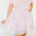 Pastel-colored dress with 'GIRL' text on a white background