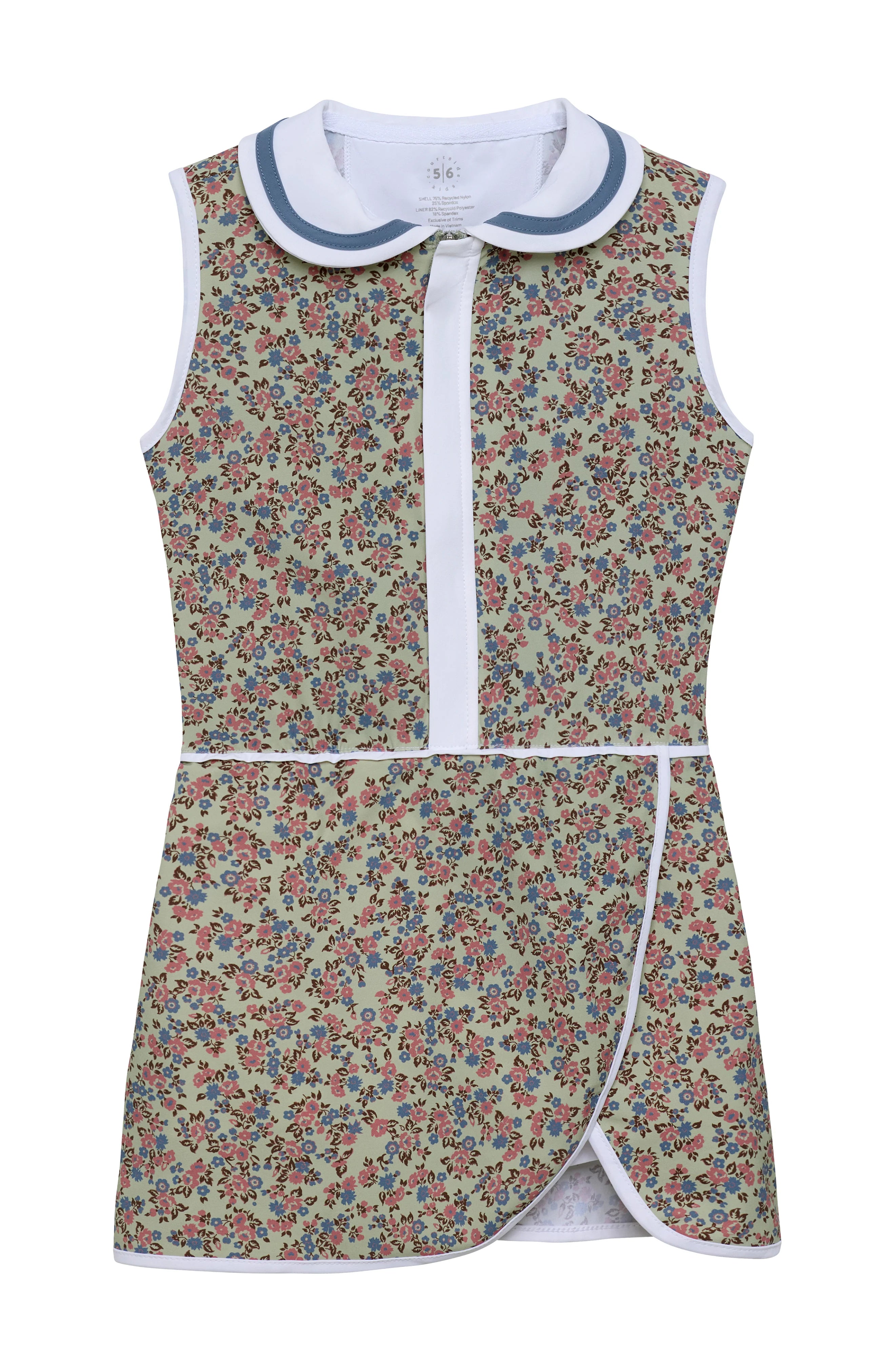 A sleeveless children's dress with a dense floral print on a green background, featuring a white Peter Pan collar with blue trim, a white front placket, and white piping details.