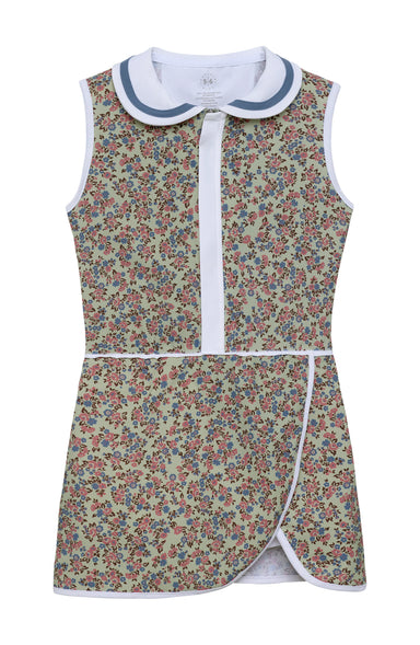 A sleeveless children's dress with a dense floral print on a green background, featuring a white Peter Pan collar with blue trim, a white front placket, and white piping details.
