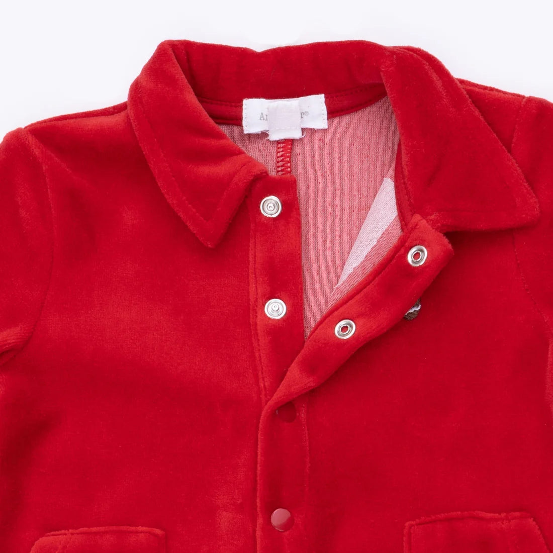 Red jumpsuit with a collar and snaps on a white background
