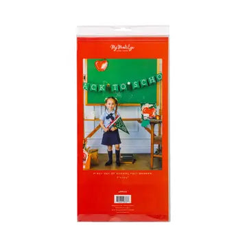 Packaged product with a girl in a school uniform and 'Back to School' decorations on a green chalkboard.