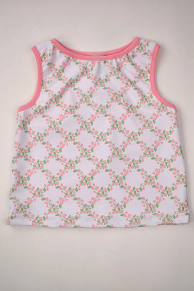 Sleeveless top with floral pattern on a beige background