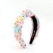 Colorful headband with decorative elements on a white background