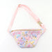 Floral and butterfly patterned fanny pack with pink strap on a white background