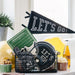 Sports-themed decor items including a 'Let's Go' banner, football helmet, and snacks on a table.