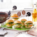 Mini burgers on a football-themed platter with sports-themed decor