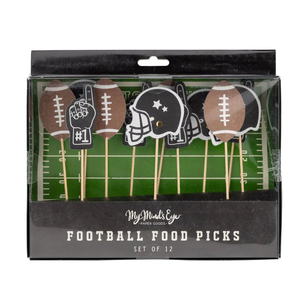 Packaged set of football-themed food picks with decorative elements on a green field background.