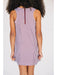 Person wearing a sleeveless checkered dress on a white background