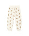 Cream-colored sweatpants with gingerbread pattern on a white background