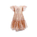 blush colored tulle dress covered in gold metallic stars