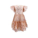 back view of blush colored tulle dress covered in gold metallic stars