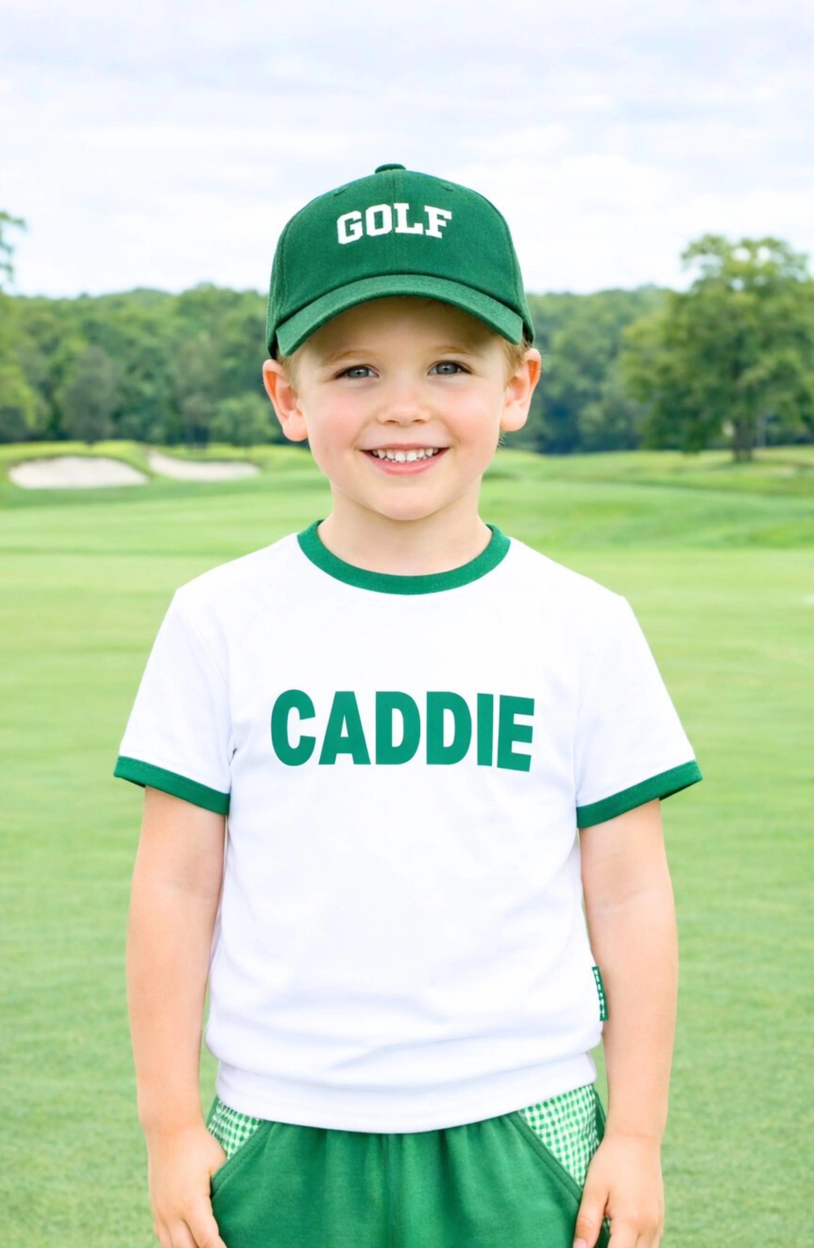 Child wearing a 'Golf Caddie' outfit on a golf course