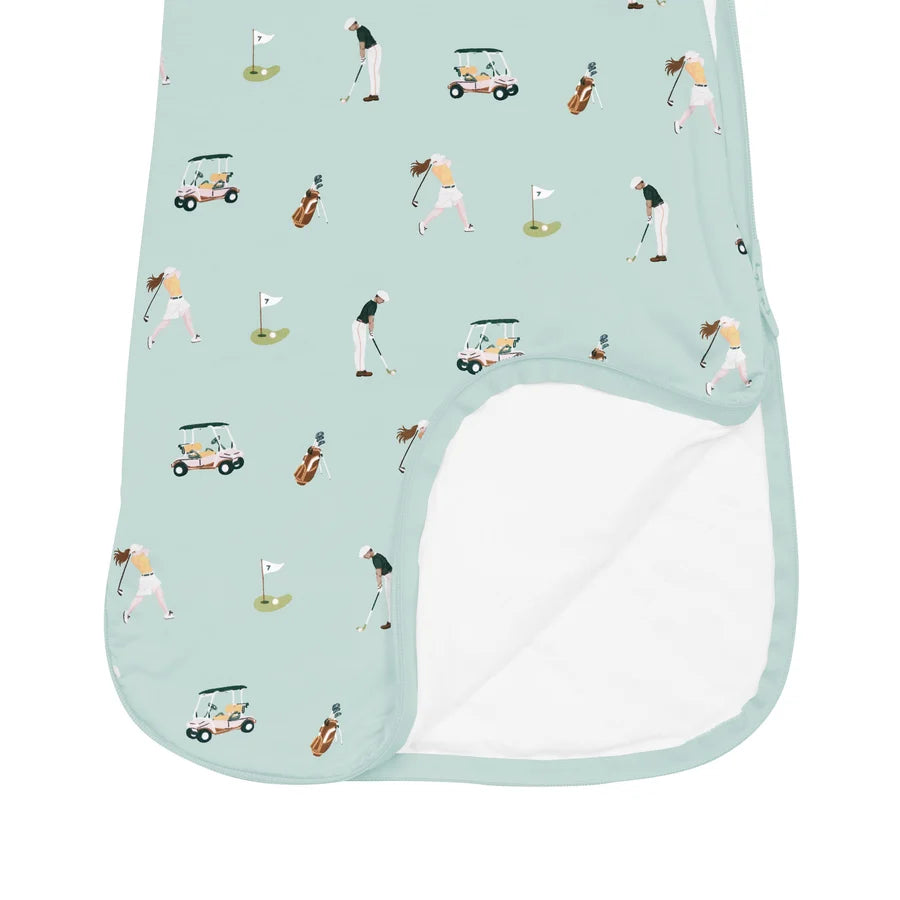 Sleep bag with golf-themed design on a light blue background