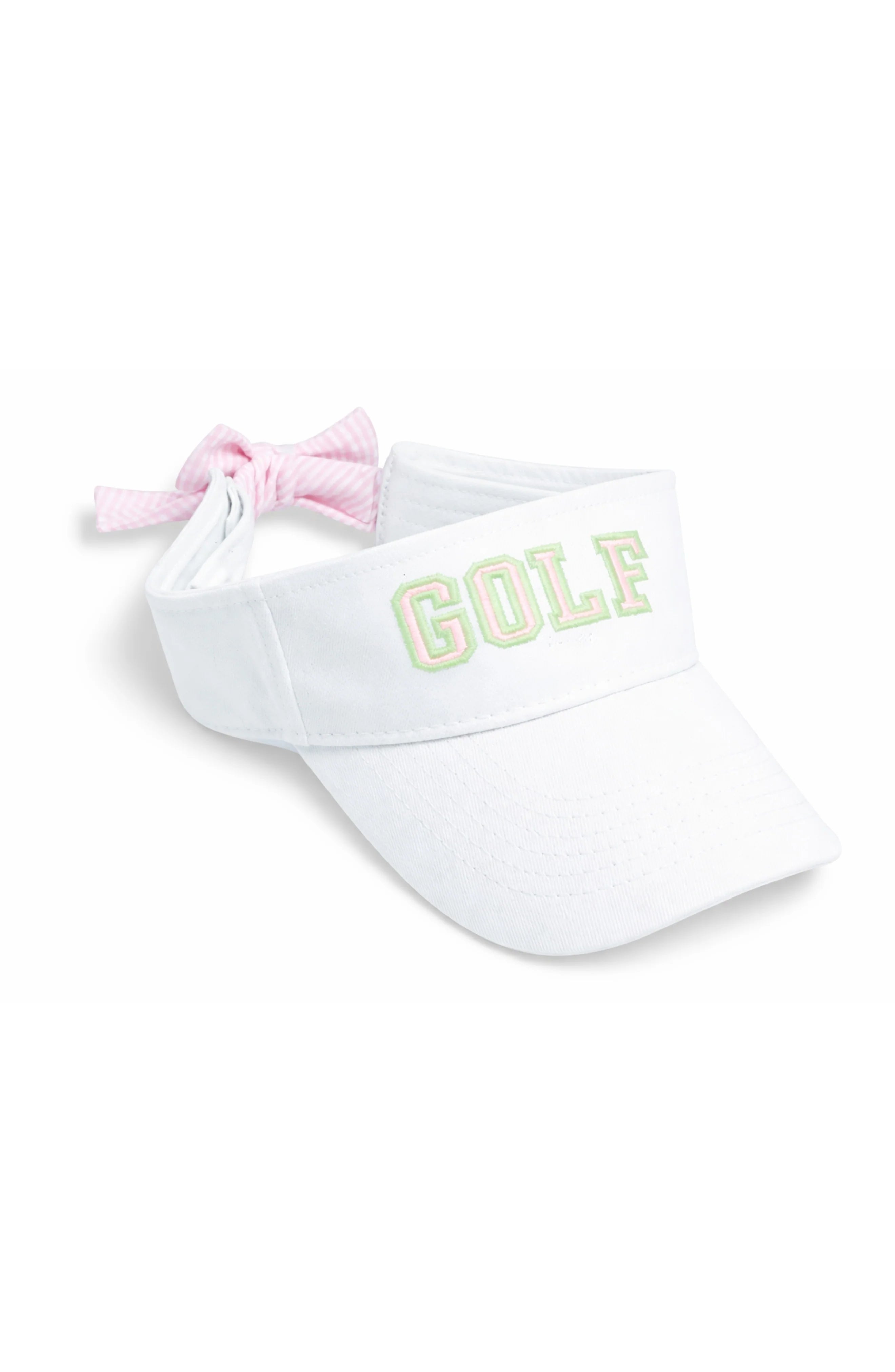 White visor with 'GOLF' text and pink hair tie on a white background