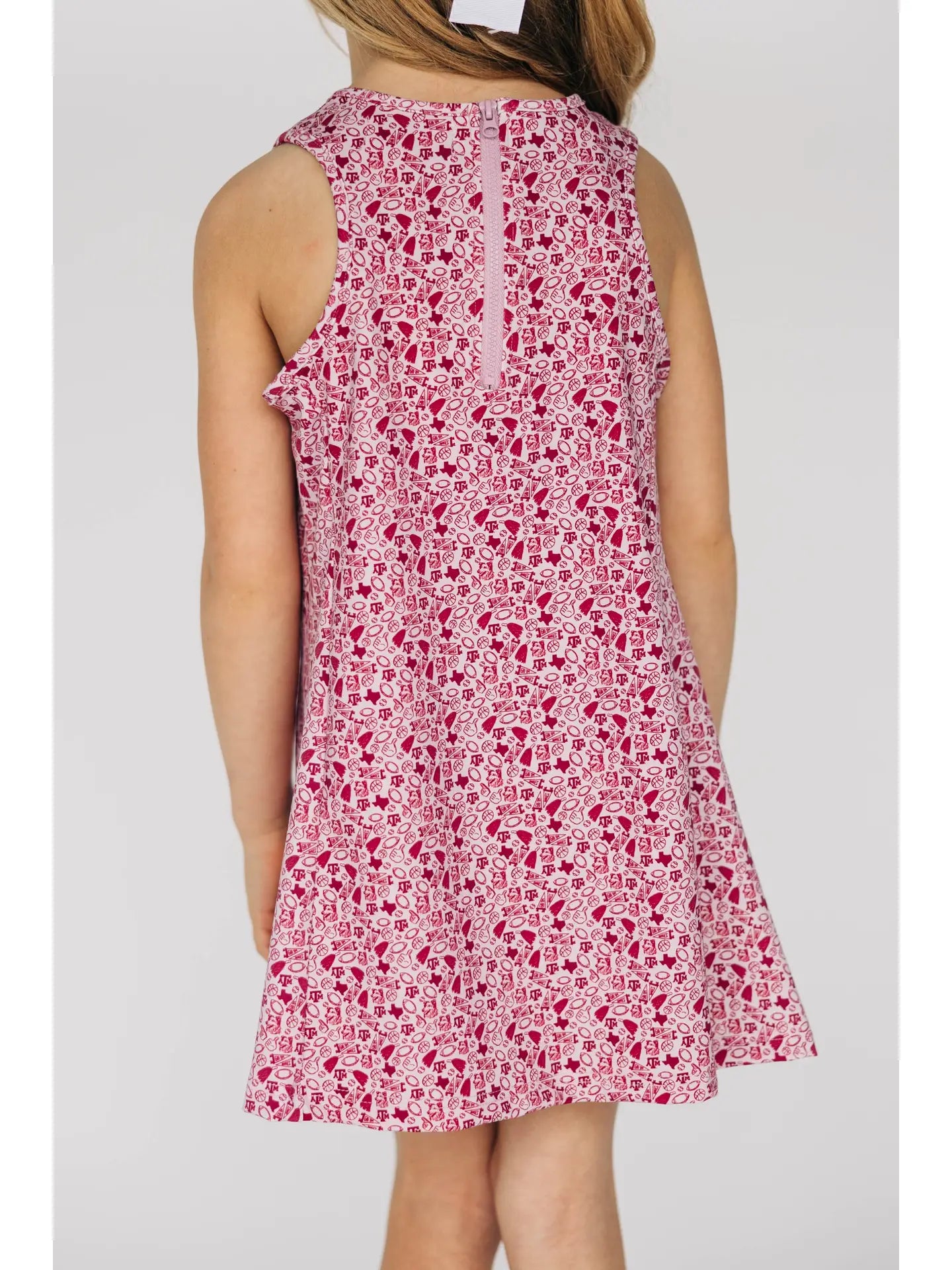 Maroon A&M dress worn by a person on a white background