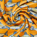Close-up of orange fabric with fish pattern