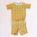 Children's loungewear set with fish pattern on a plain background