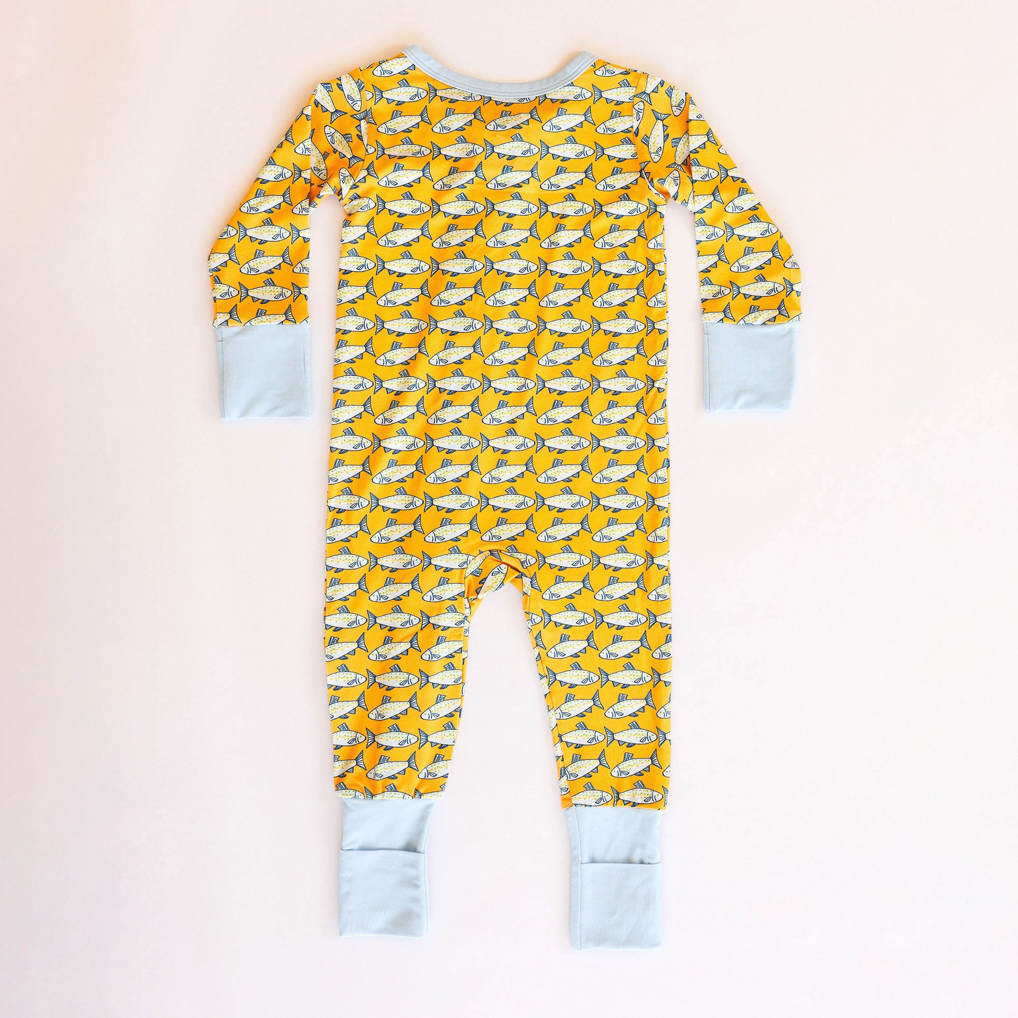 Yellow pajama set with fish pattern on a white background