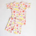 Girl's loungewear set with beach-themed print on a light gray background