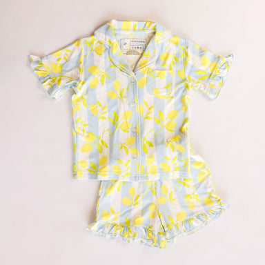 Children's two-piece pajamas with lemon pattern on a white background