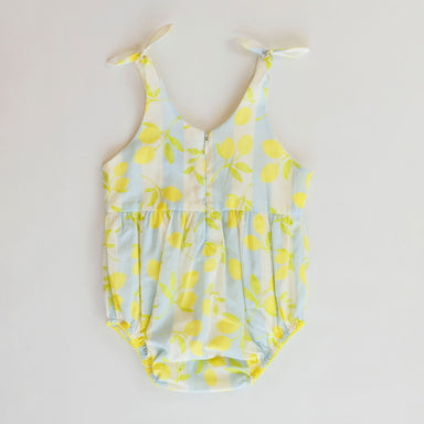 Blue romper with lemon pattern on a white background