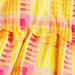 Close-up of a colorful checkered fabric with yellow, pink, and orange patterns.