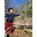 boy wering navy colored knit sweater with button closure and pocket