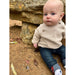 baby boy wearing oatmeal colored knit sweater with button closure