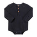 A dark navy blue long-sleeve baby bodysuit with a three-button henley neckline, laid flat on a white background.
