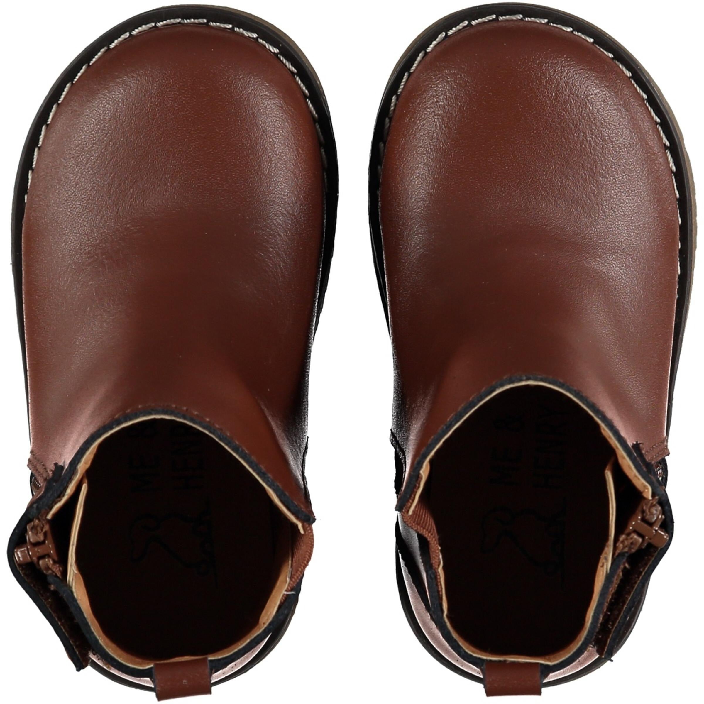 top view of dark brown leather chelsea boots with zipper on the side