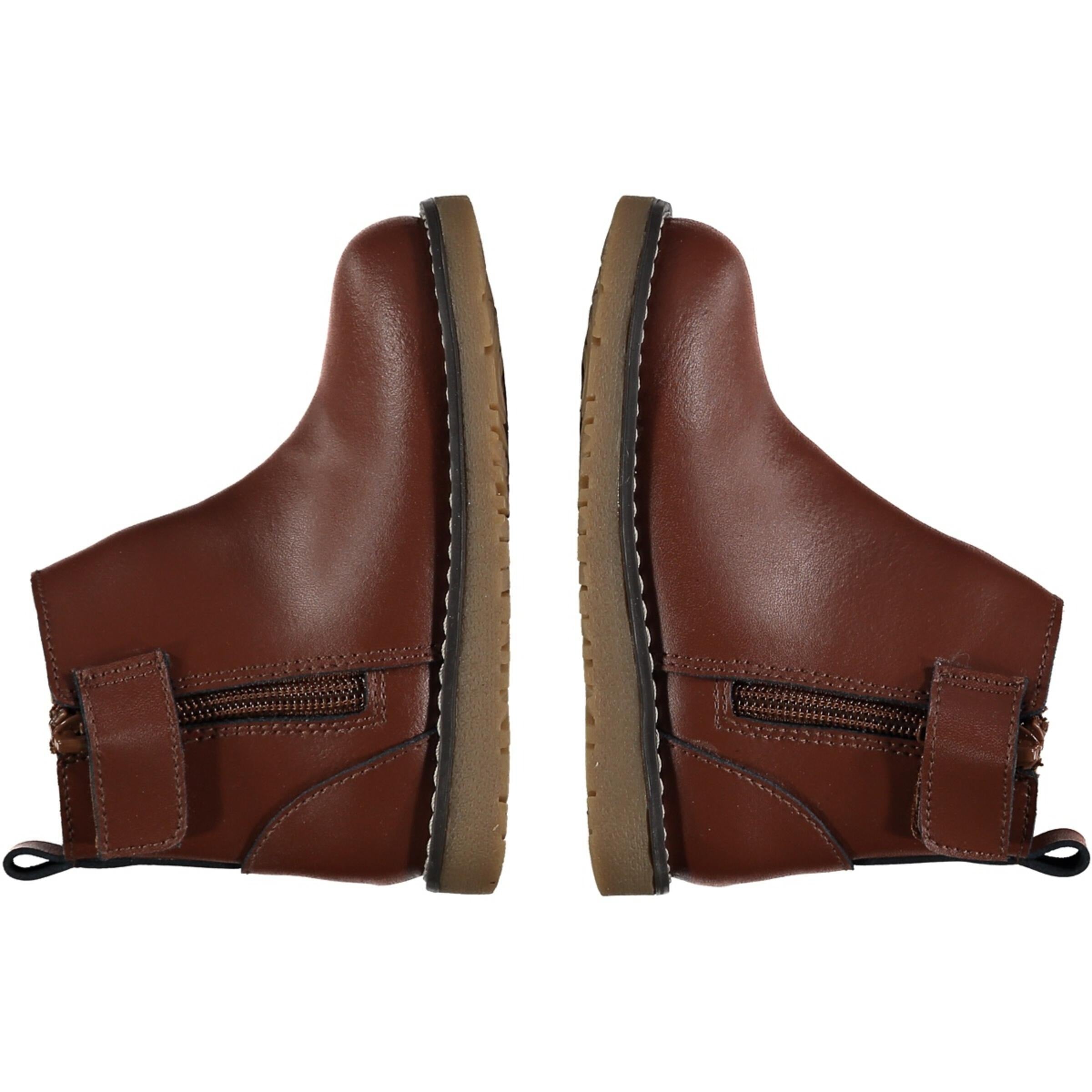 side view of dark brown leather chelsea boots with zipper on the side
