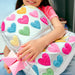Girl carrying a Happy Fuzzy Hearts Double Pocket Backpack