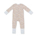 A baby long-sleeve footless one-piece jumpsuit with a dense floral print in brown and blue on a cream background, featuring solid light blue cuffs.
