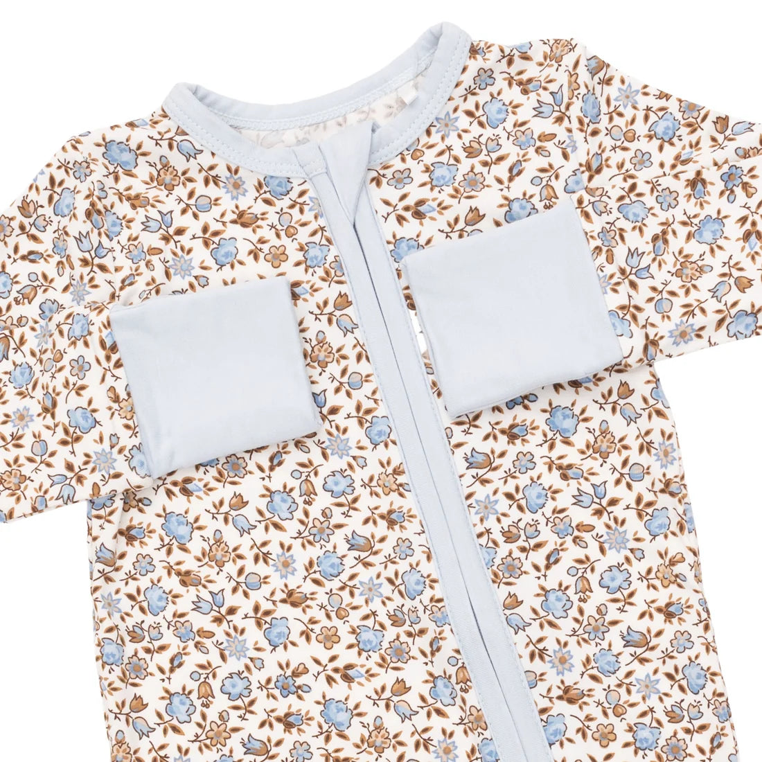 A baby outfit with a long-sleeve design, featuring a brown and blue floral pattern on a cream background, with contrasting light blue trim.