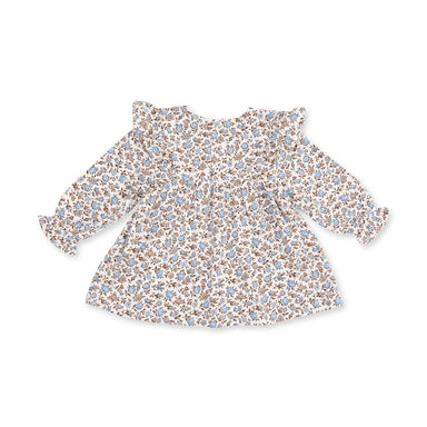 A long-sleeve baby tunic with a ruffled neckline and cuffs, featuring a dense all-over floral print in light blue, brown, and beige on a white background.