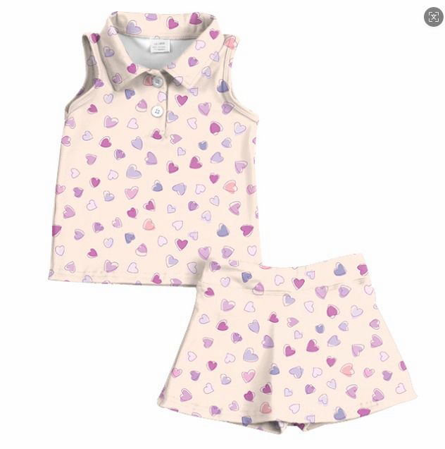 Children's sleeveless dress with heart pattern on a white background