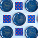 Set of blue plates and napkins with 'Home of the Free, Land of the Brave' text and star patterns on a light blue background.