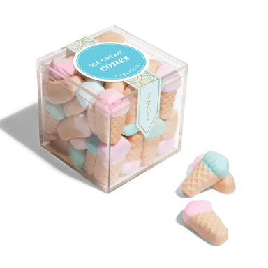 Pastel-colored ice cream cone-shaped candies in a clear box with a label.