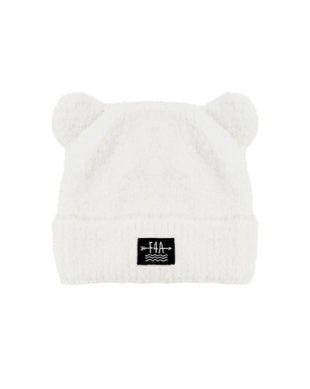A white plush beanie hat with small bear ears on top and a black square logo patch on the front cuff, shown against a plain white background.