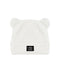 A white plush beanie hat with small bear ears on top and a black square logo patch on the front cuff, shown against a plain white background.
