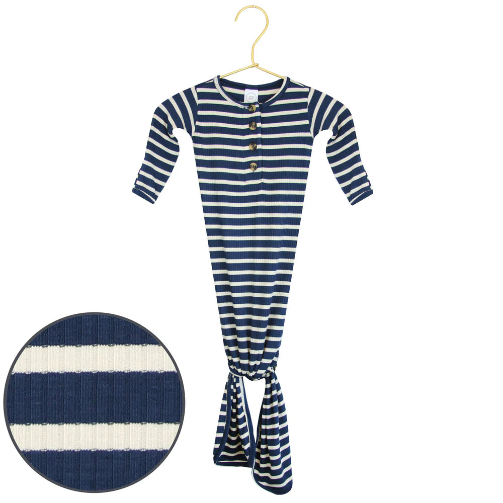 Navy and white striped baby knotted gown on a hanger with close-up of fabric texture.