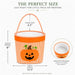 An orange and white gingham Halloween treat basket with an orange pumpkin face graphic, shown with measurement callouts for height, width, and handle drop, plus a circular inset showing the spacious interior.