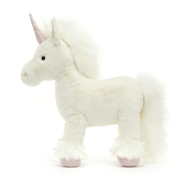 side view of white unicorn stuffed animal