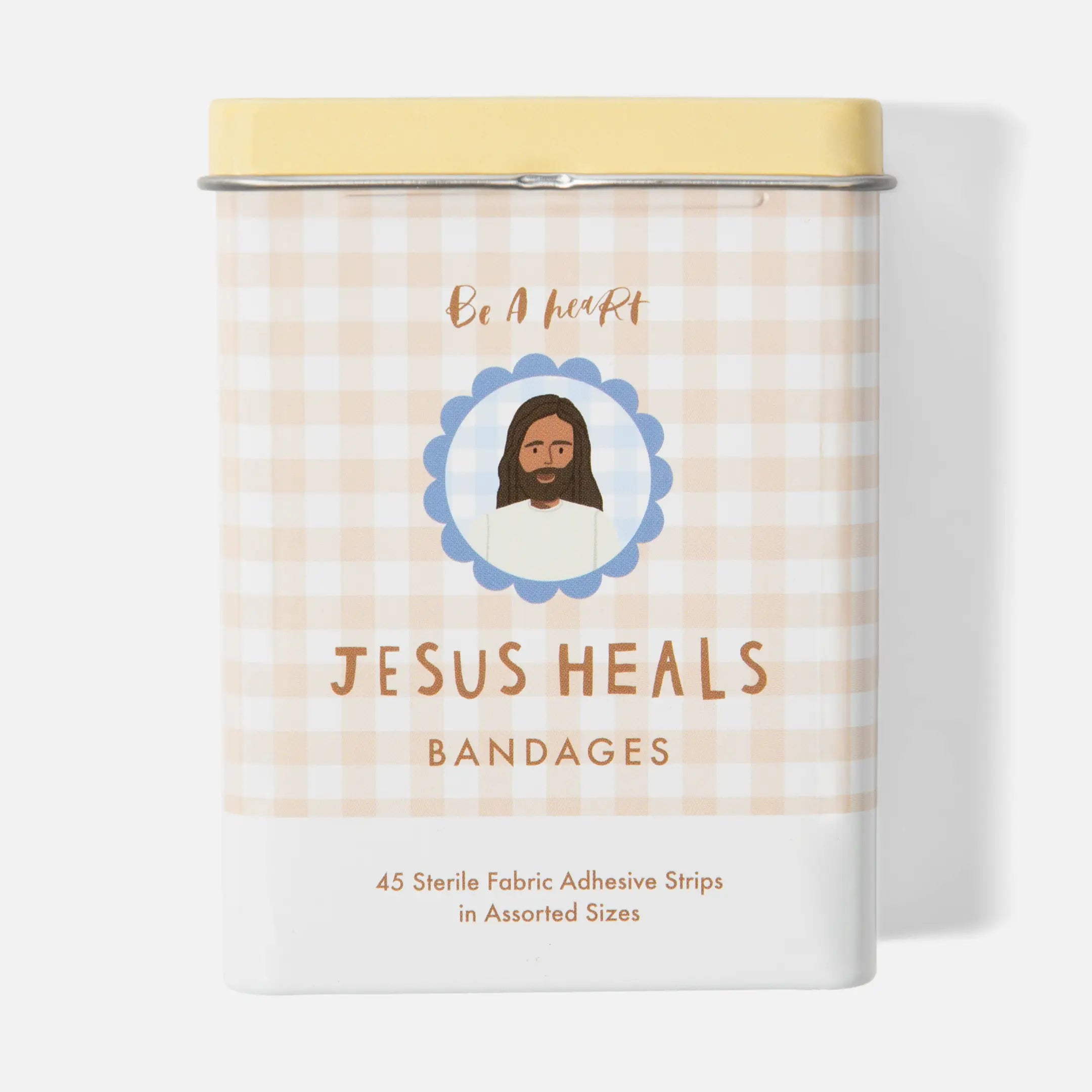 Bandage container with 'Jesus Heals' text and checkered pattern on a white background
