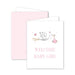 Greeting card with stork carrying a baby girl and 'Welcome Baby Girl' text on a white background.