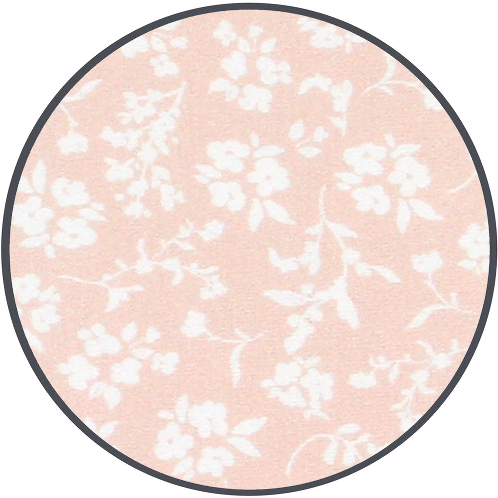 A fabric sample showing a soft blush pink background with a delicate white floral pattern, framed by a thin dark gray border on a white background.