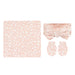 A baby accessory set featuring a square blanket, a matching bow headband, and a pair of mittens, all in a soft peach-pink color with a delicate white floral pattern, displayed on a solid white background.