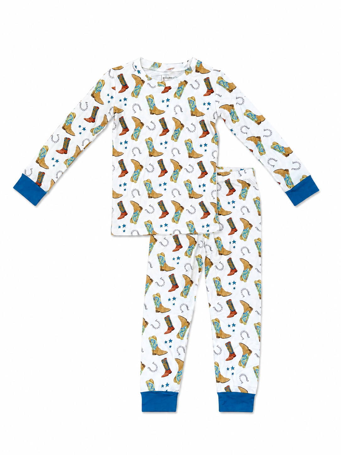 A two-piece children's pajama set featuring a white long-sleeve top and matching pants with a colorful cowboy boots and horseshoe pattern, finished with solid blue cuffs and ankles.