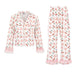 A two-piece girls' pajama set featuring a long-sleeve button-front top and matching wide-leg pants, both in white with a pink cherry and heart pattern and pink ruffled trim.